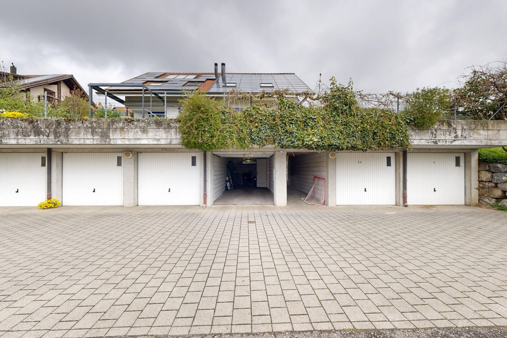 view of property with roof mounted solar panels