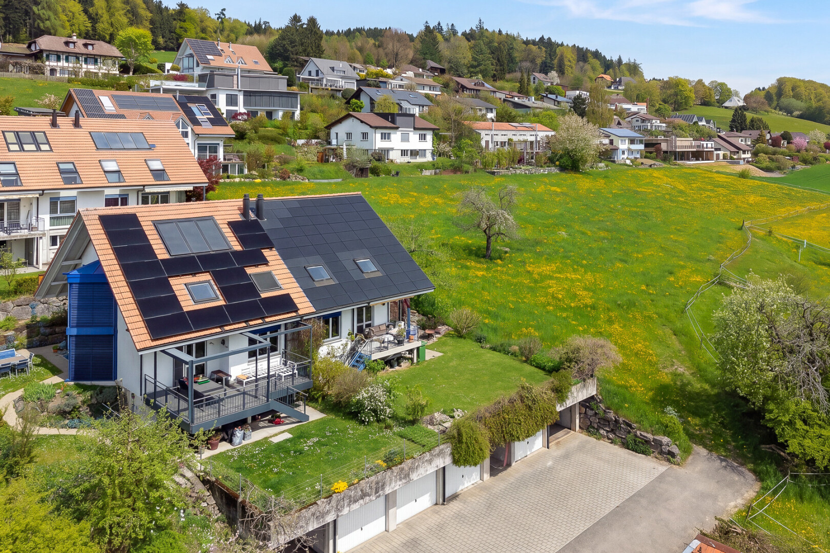 outdoor house featuring solar panels and a wooden deck