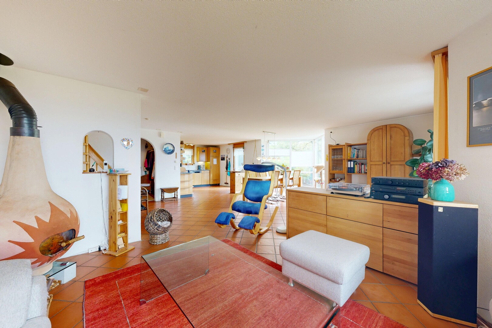living area with arched walkways and stairway