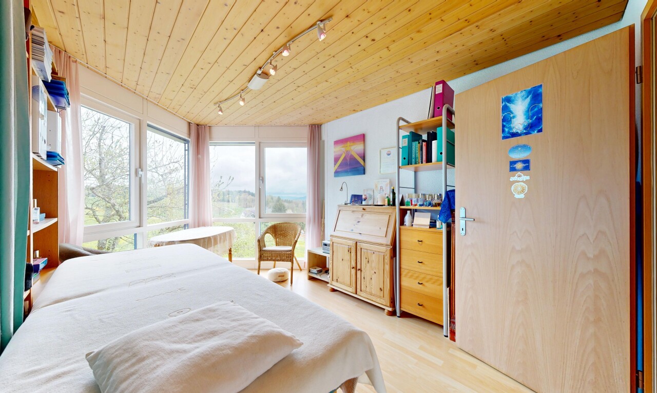 room / bedroom with track lighting, wood ceiling, and light wood finished floors
