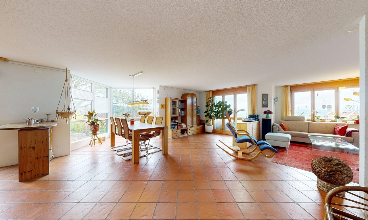 living room featuring light tile patterned floors and a textured ceiling