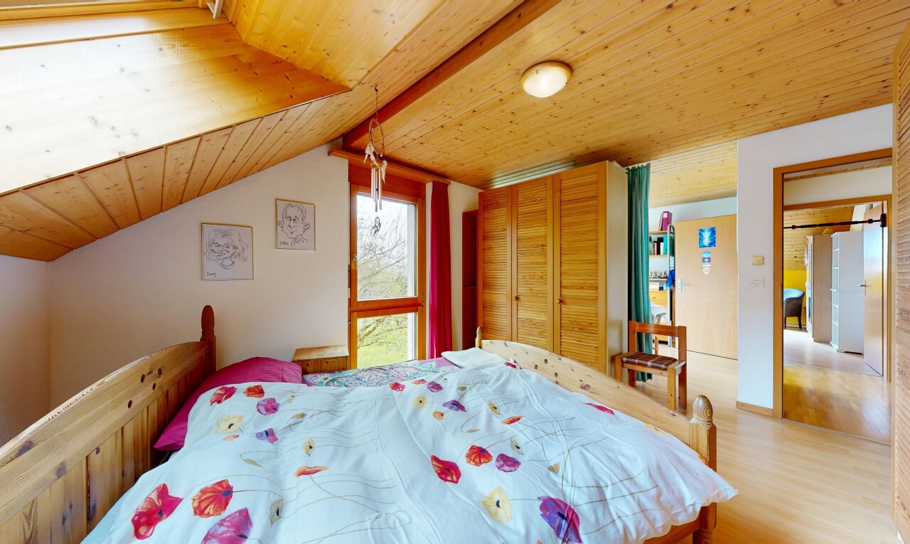 room / bedroom featuring wood ceiling, wood finished floors, a closet, and freestanding refrigerator
