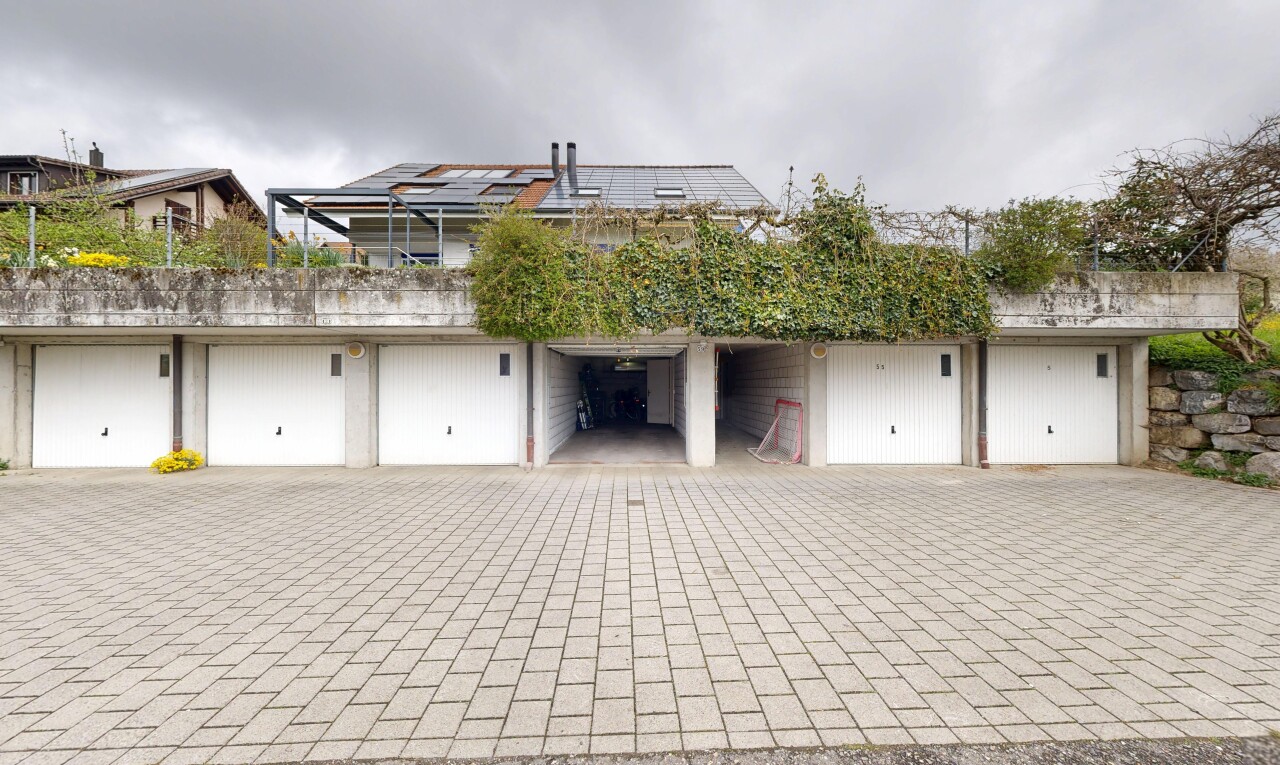 view of property with roof mounted solar panels