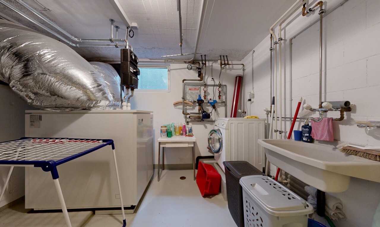 interior space with finished concrete floors and washing machine and clothes dryer