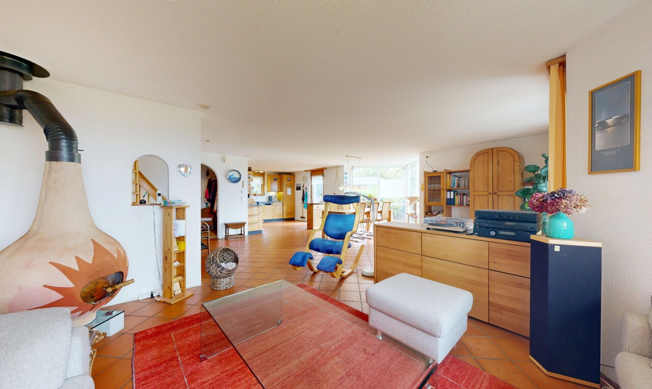 living area with arched walkways and stairway