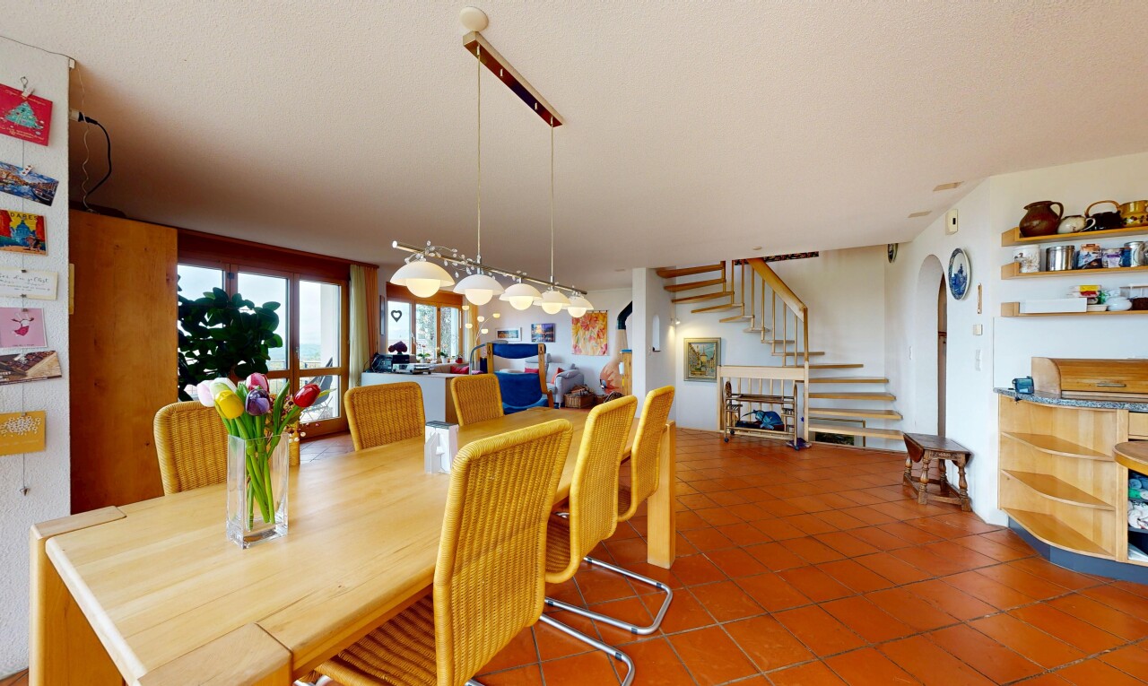dining room featuring stairs and tile patterned flooring