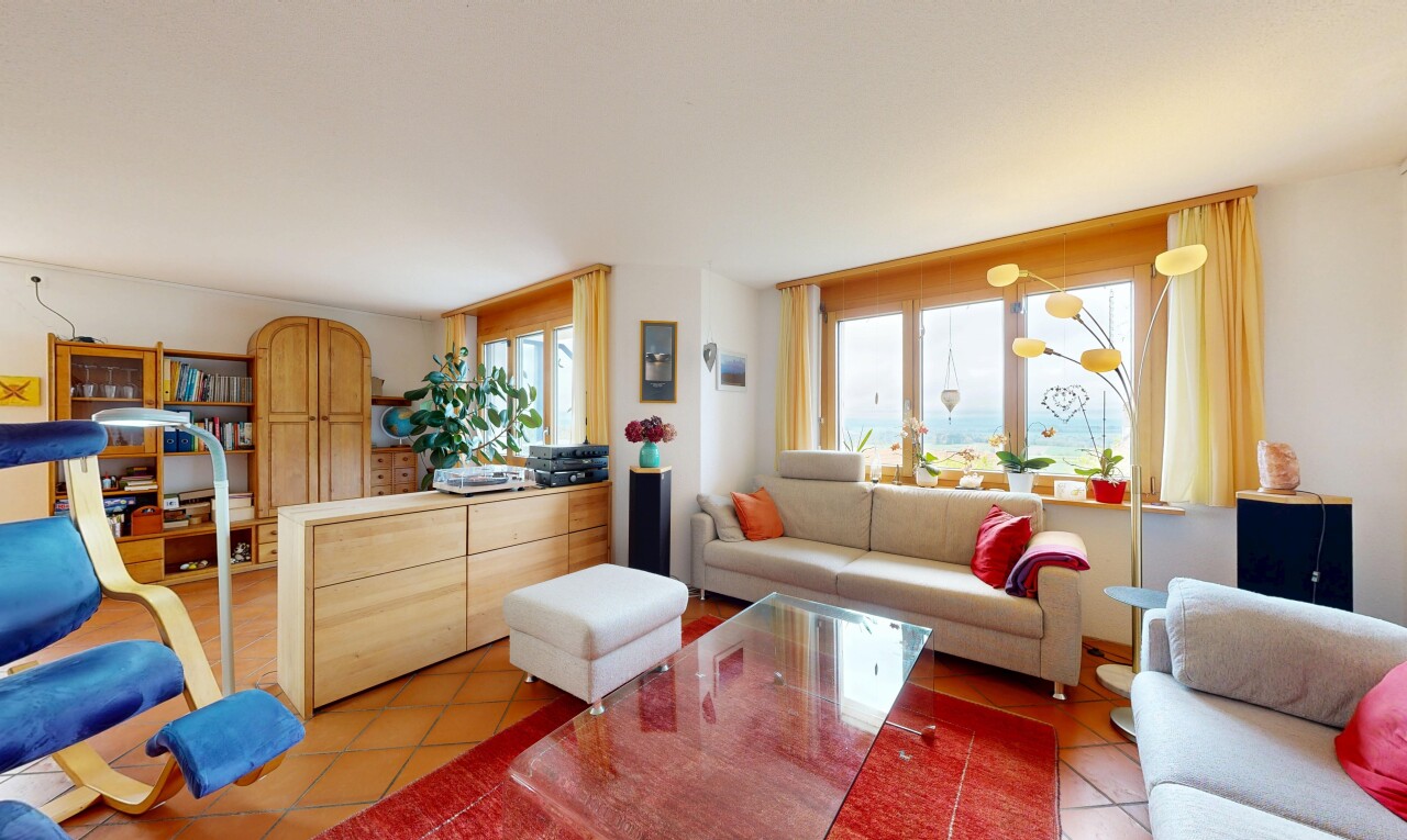 living area featuring light tile patterned flooring