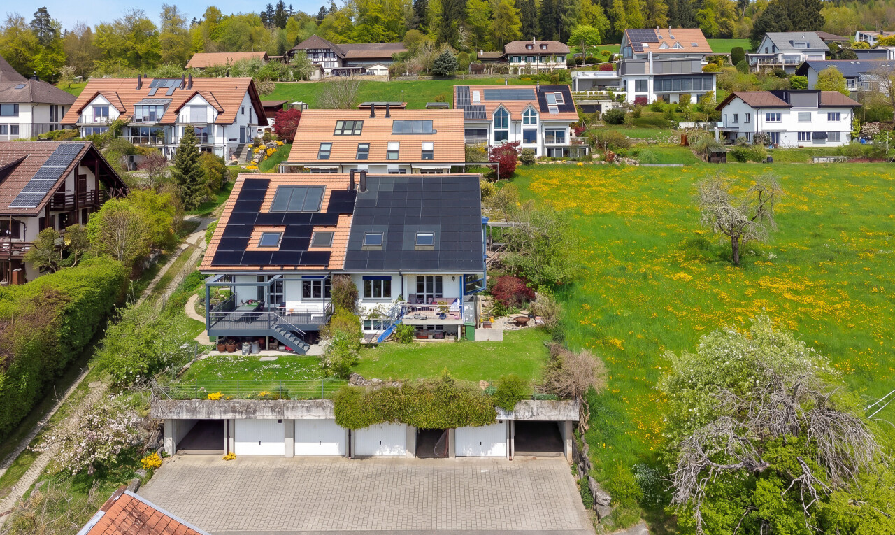 outdoor house with solar panels and a residential view