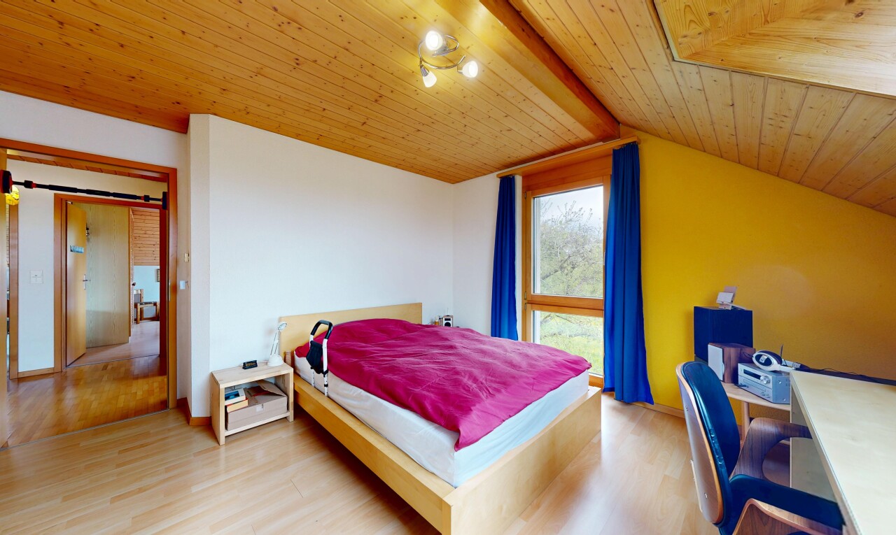 room with light wood-style floors, wooden ceiling, and a desk