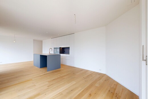 salon avec light floor, wood finish floor, sol en finition bois, inside property, et drywall