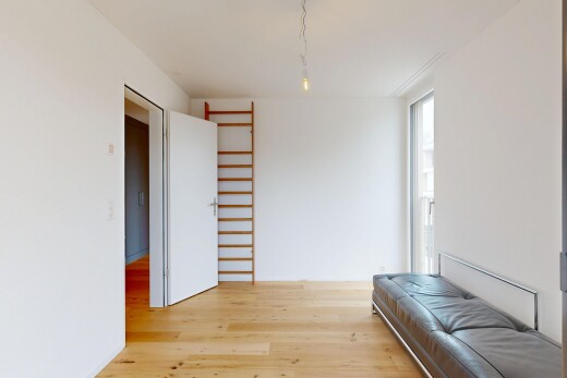 chambre avec cloison sèche, drywall, sol en finition bois, wood finish floor, et inside property