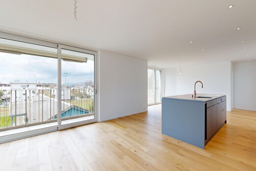 cuisine avec inside property, light floor, wood finish floor, sol en finition bois, et light countertops