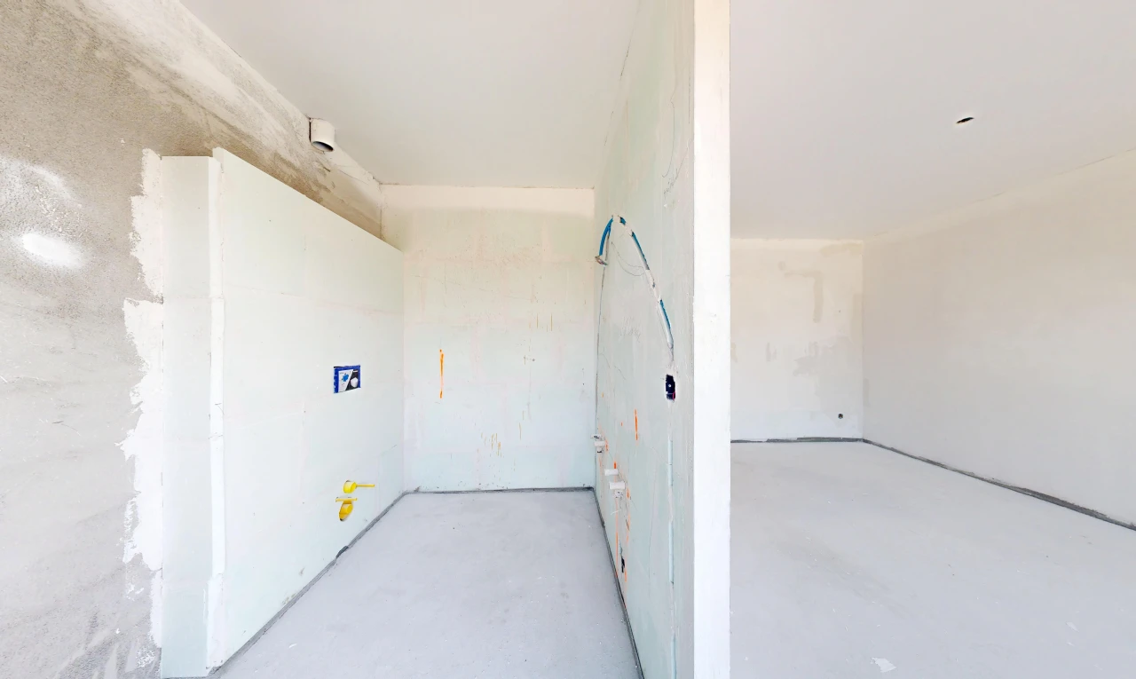 pièce vide avec inside property, concrete floor, et sol en béton