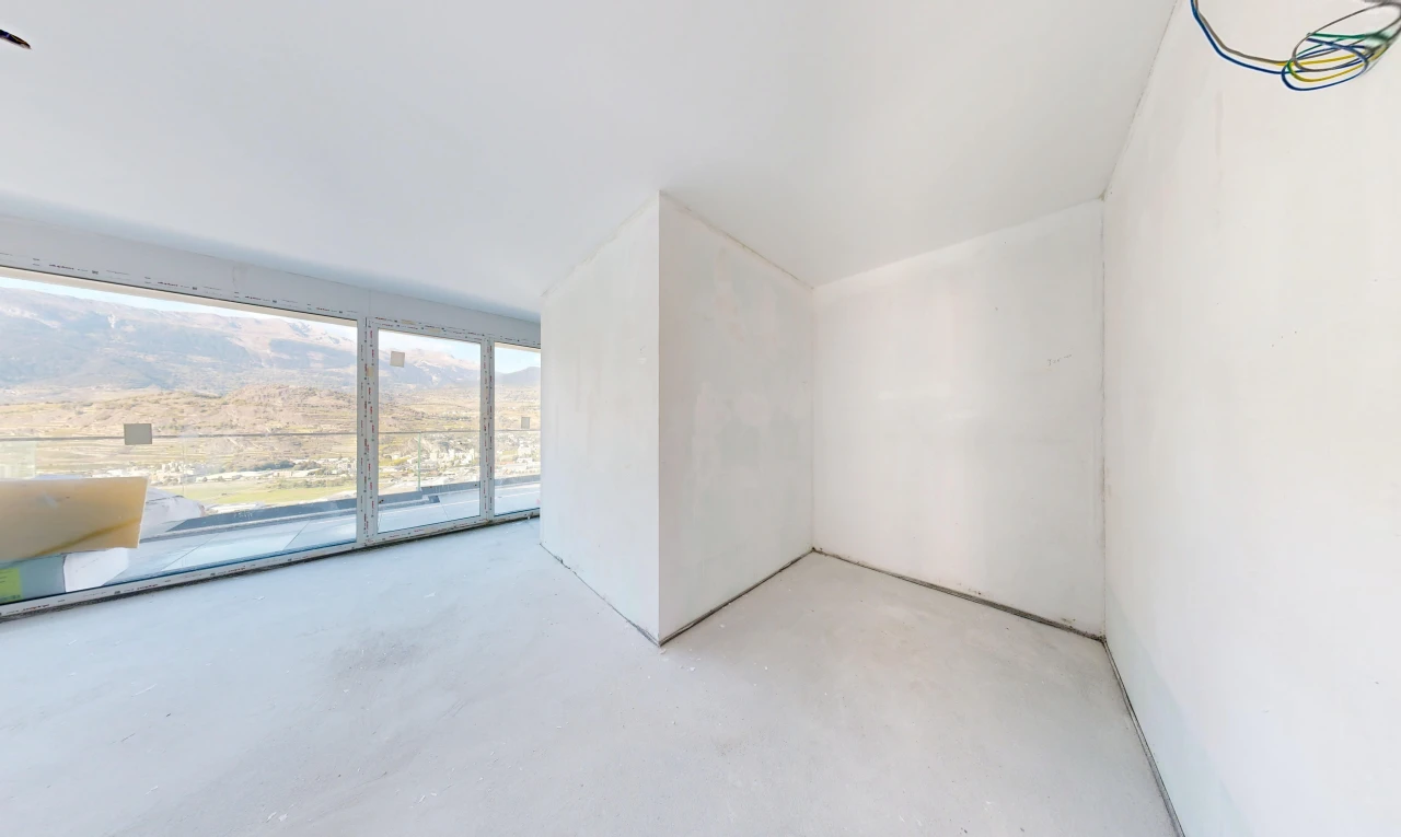 pièce vide avec inside property, sol en béton, concrete floor, cloison sèche, et drywall