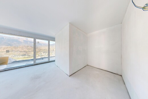pièce vide avec inside property, sol en béton, concrete floor, cloison sèche, et drywall