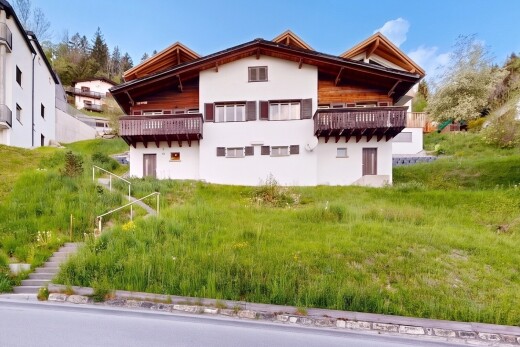 view of home with stucco siding and a balcony