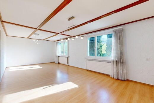 unfurnished room featuring light wood-style flooring and a textured wall