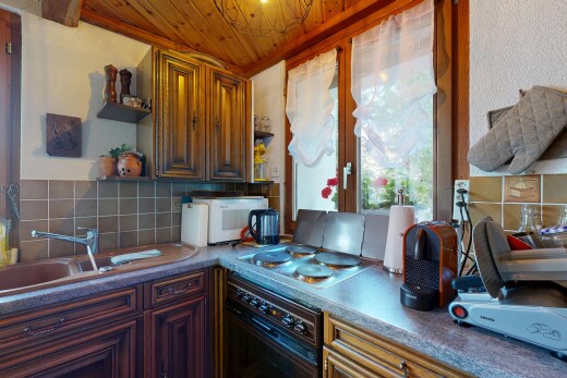 kitchen featuring open shelves, black oven, wood ceiling, tasteful backsplash, and dark countertops