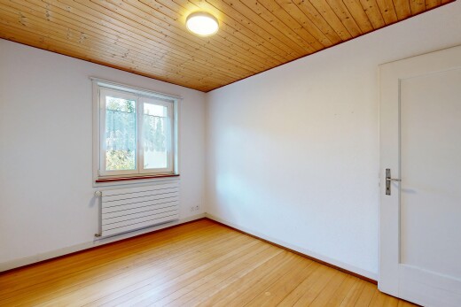 empty room with wooden ceiling, radiator, and light wood-type flooring