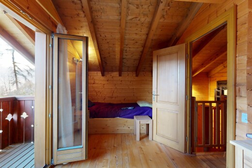 unfurnished room with wood walls, wood ceiling, and light wood-type flooring