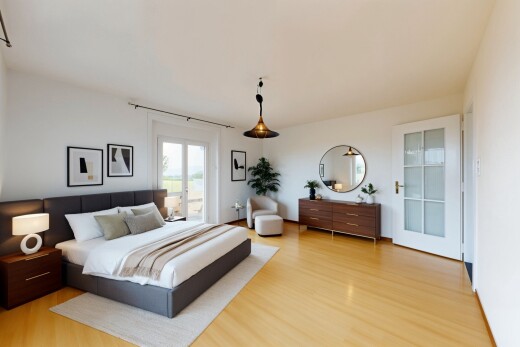 chambre avec wood finish floor, natural light, sol en finition bois, lumière naturelle, et drywall