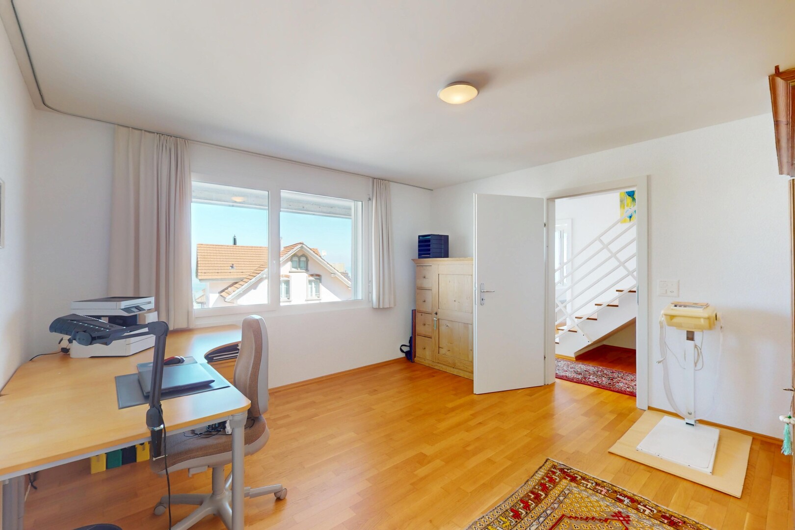 home office with light wood-style flooring