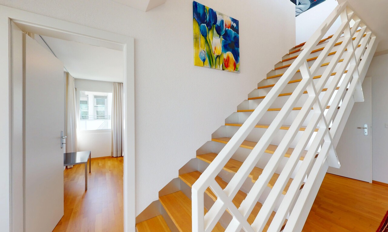 stairs with wood finished floors