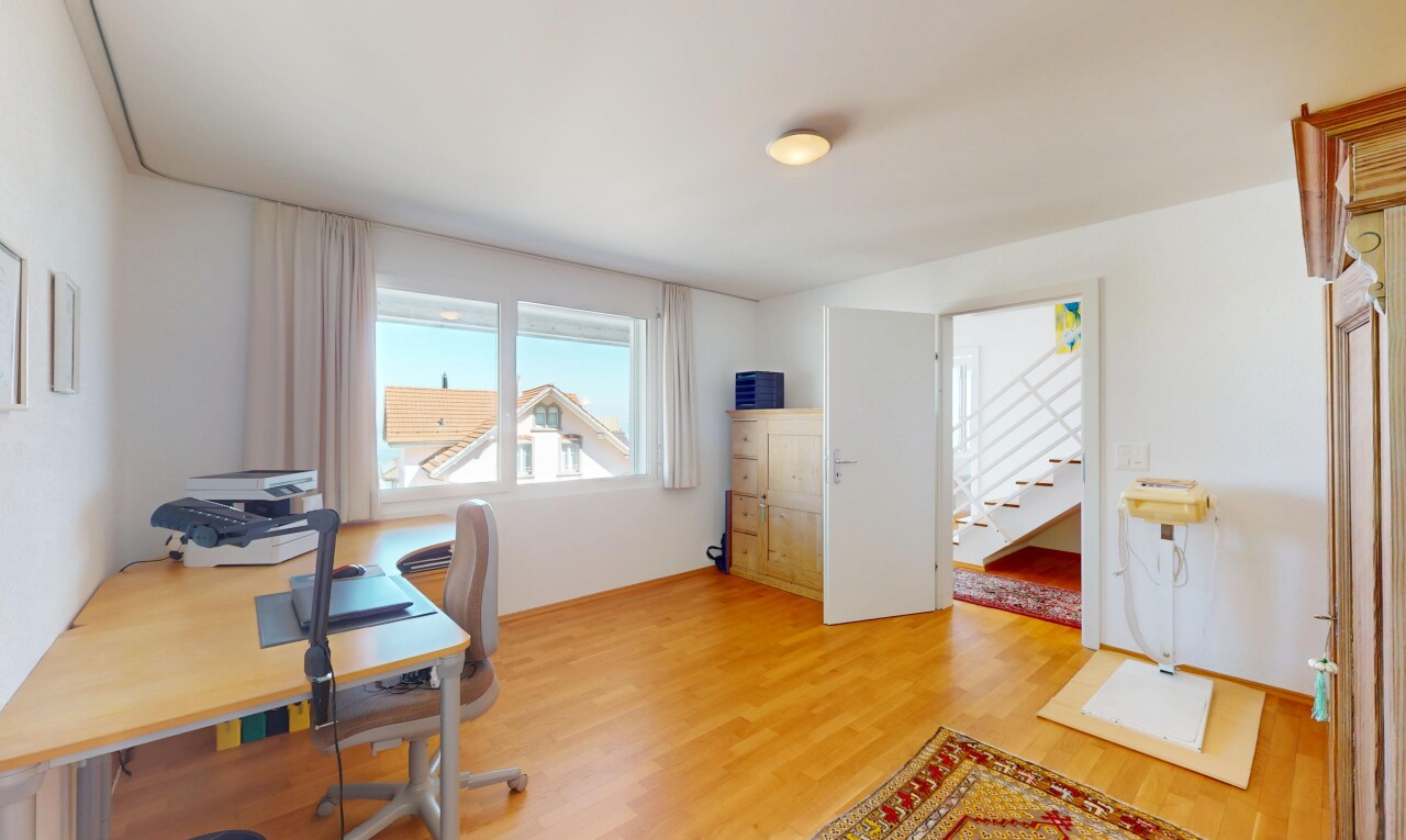 home office with light wood-style flooring