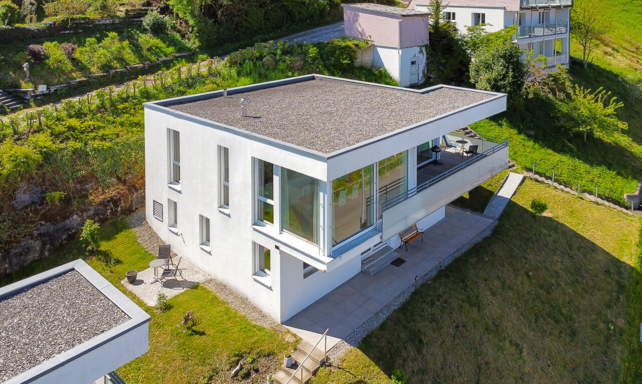 view of property featuring a lawn and a patio