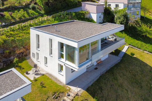 view of property featuring a lawn and a patio