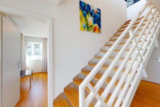 stairs with wood finished floors