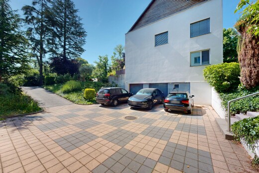façade avec day time, bardage en stuc, allée, et garage intégré