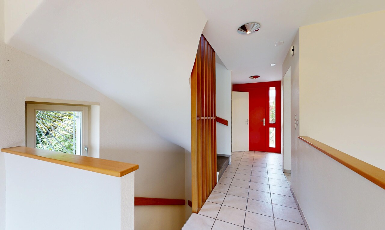 corridor with light tile patterned flooring