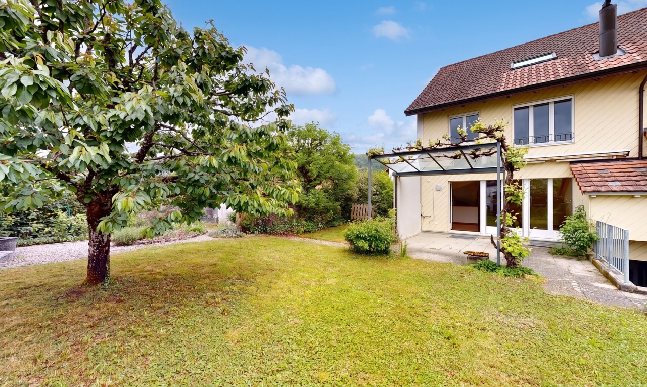 view of home featuring a yard, a patio, and a shingled roof
