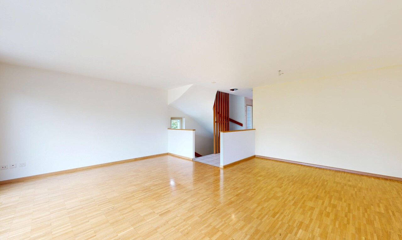 unfurnished room with light wood-type flooring and baseboards