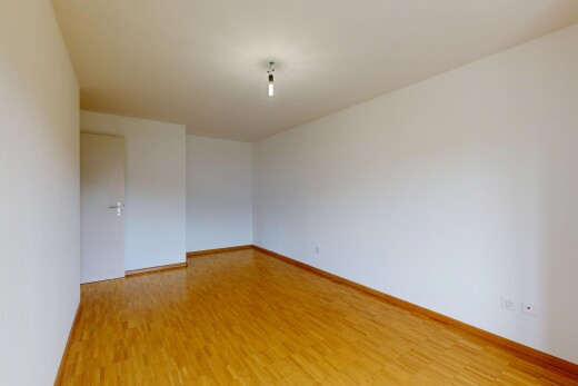 empty room featuring light wood finished floors and baseboards