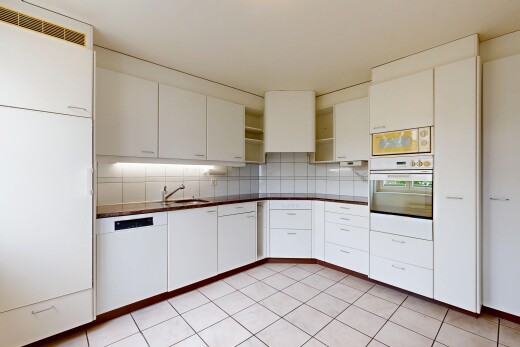 kitchen with white appliances, open shelves, white cabinetry, and decorative backsplash