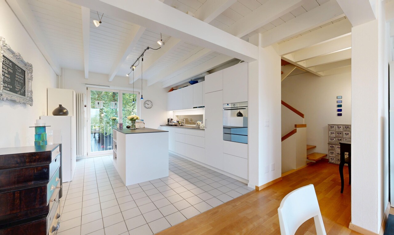küche mit white cabinets, weiße schränke, light floor, treppen, und flat panel cabinets