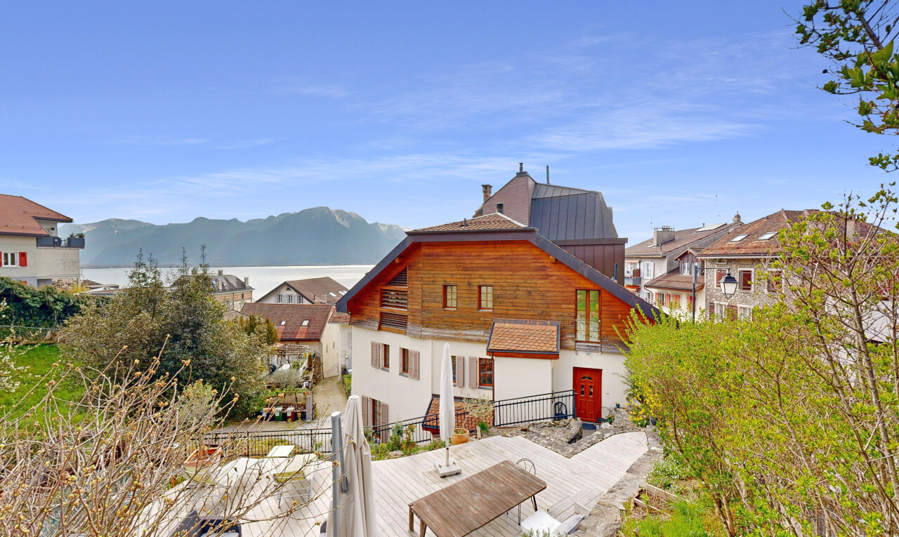 outdoor house featuring metal roof and a mountain view