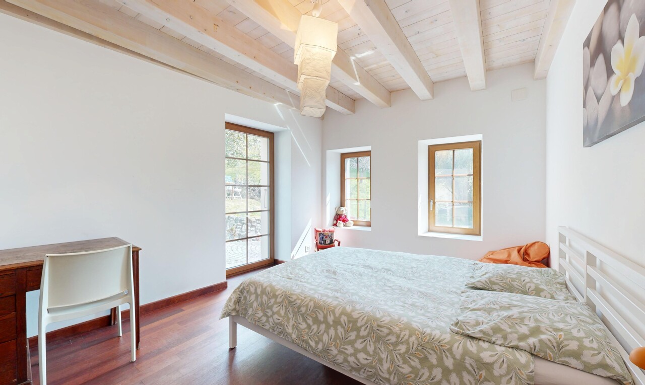 room featuring wooden ceiling, baseboards, beamed ceiling, and wood finished floors
