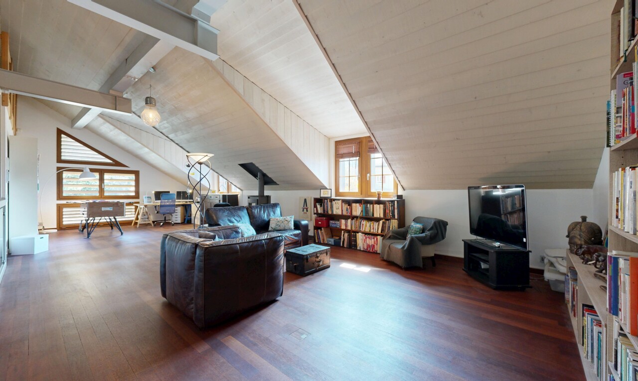 living area featuring wood finished floors and vaulted ceiling