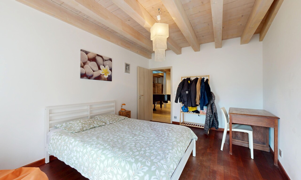 room / bedroom with beamed ceiling, wood finished floors, and wooden ceiling