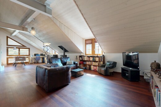 living area featuring wood finished floors and vaulted ceiling