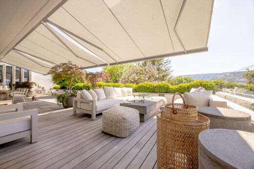 terrasse avec espace de vie extérieur, auvent, terrasse, et from property