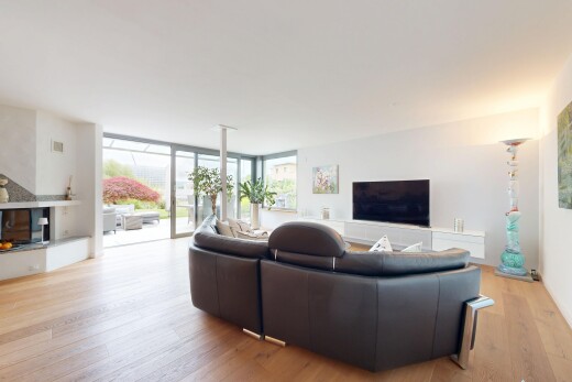 living area featuring floor to ceiling windows and light wood-type flooring