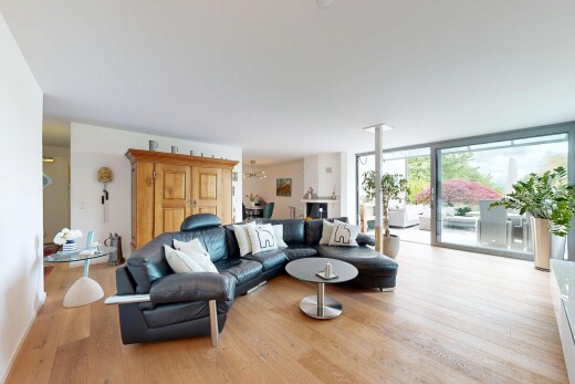 living area featuring light wood-style floors and expansive windows