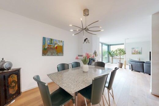dining space with light wood-style flooring, a chandelier, and floor to ceiling windows