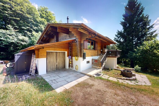 outdoor house featuring stairway