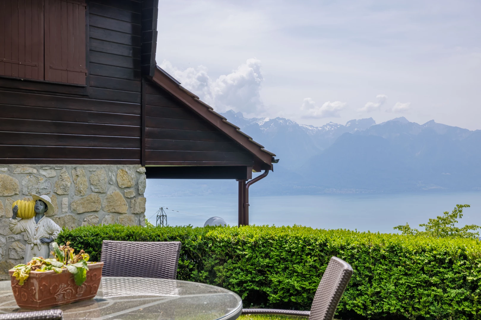 view of side of home with a mountain view