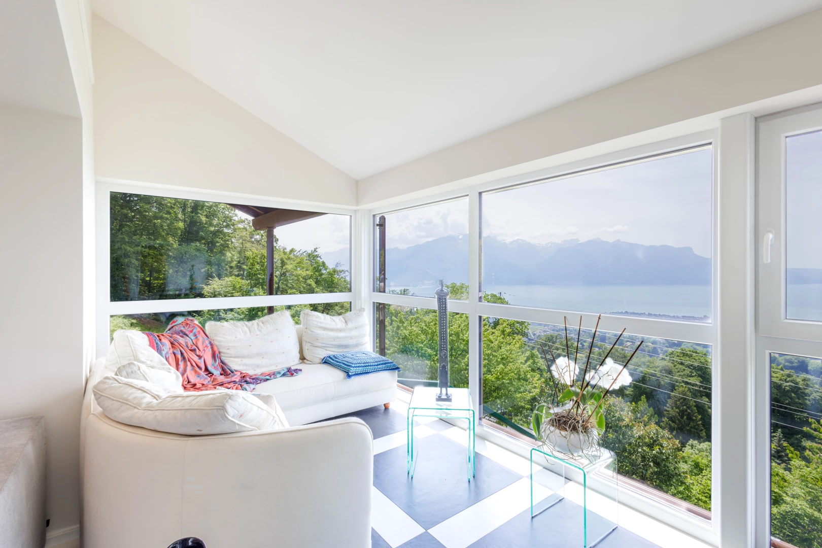 sunroom featuring vaulted ceiling and natural light